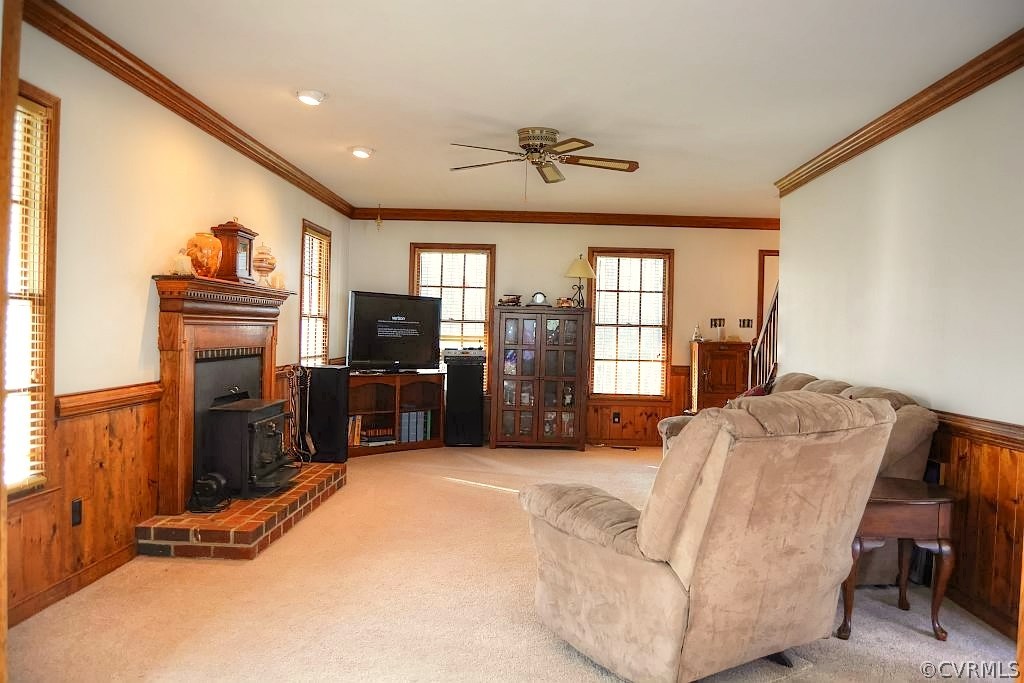 11715 Winterpock Road Chesterfield, VA 23838 - Photo 12 of 21 a living room with furniture a flat screen tv and kitchen view