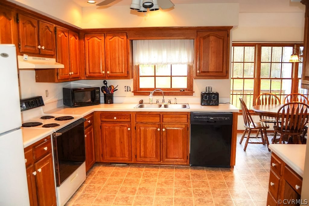 11715 Winterpock Road Chesterfield, VA 23838 - Photo 15 of 21 a kitchen with a sink a stove cabinets and a dining table