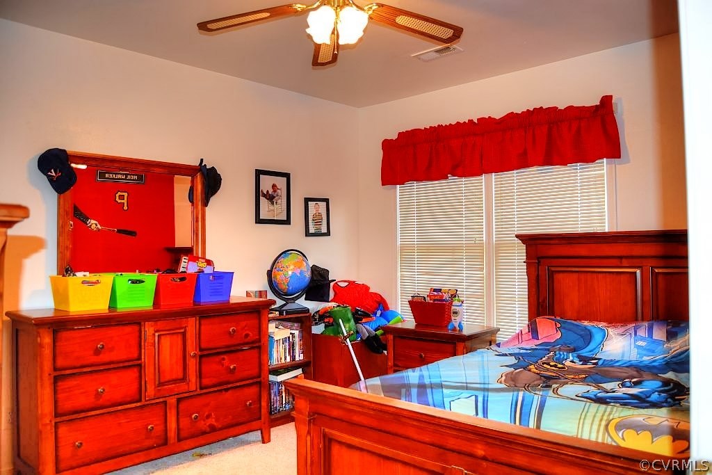 11715 Winterpock Road Chesterfield, VA 23838 - Photo 21 of 21 a living room filled with furniture and a baby crib