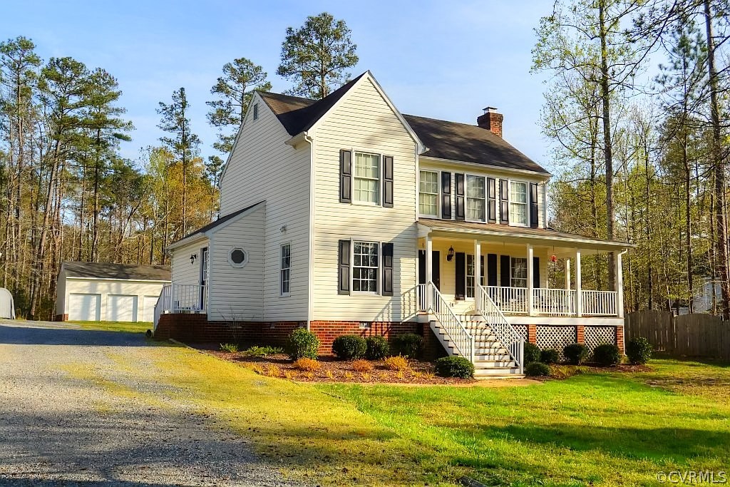 11715 Winterpock Road Chesterfield, VA 23838 - Photo 4 of 21 a front view of a house with a yard table and chairs