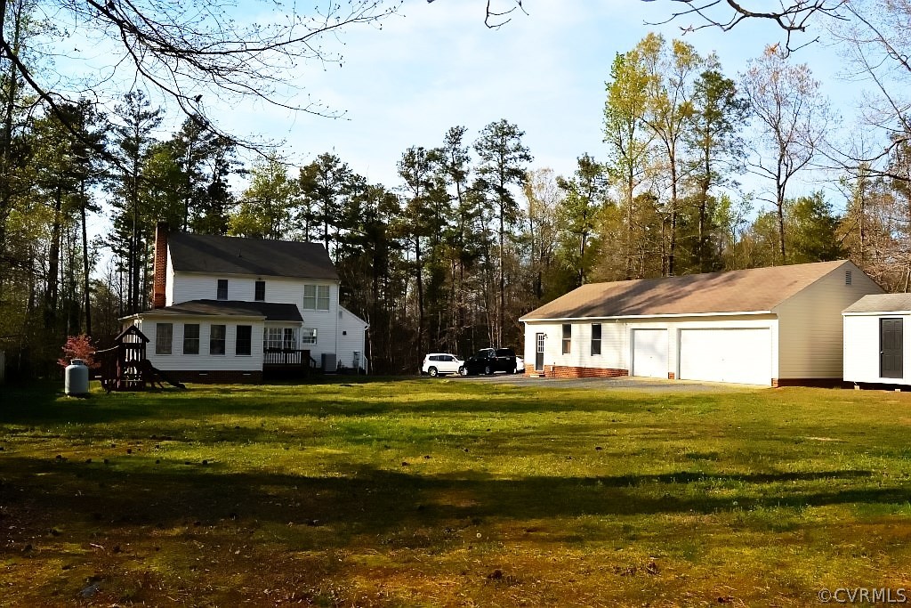 11715 Winterpock Road Chesterfield, VA 23838 - Photo 9 of 21 a front view of a house with a garden