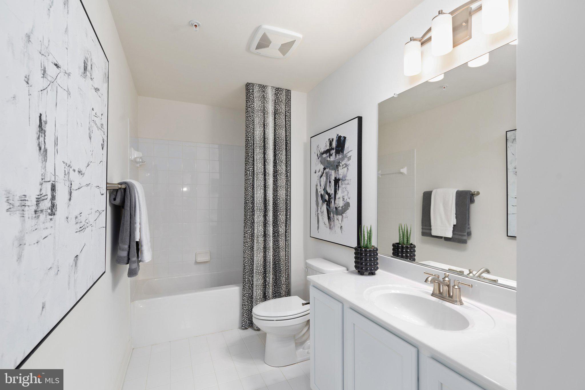 529 C Trimble Road Joppa, MD 21085 - Photo 13 of 26 a bathroom with a sink a toilet and shower