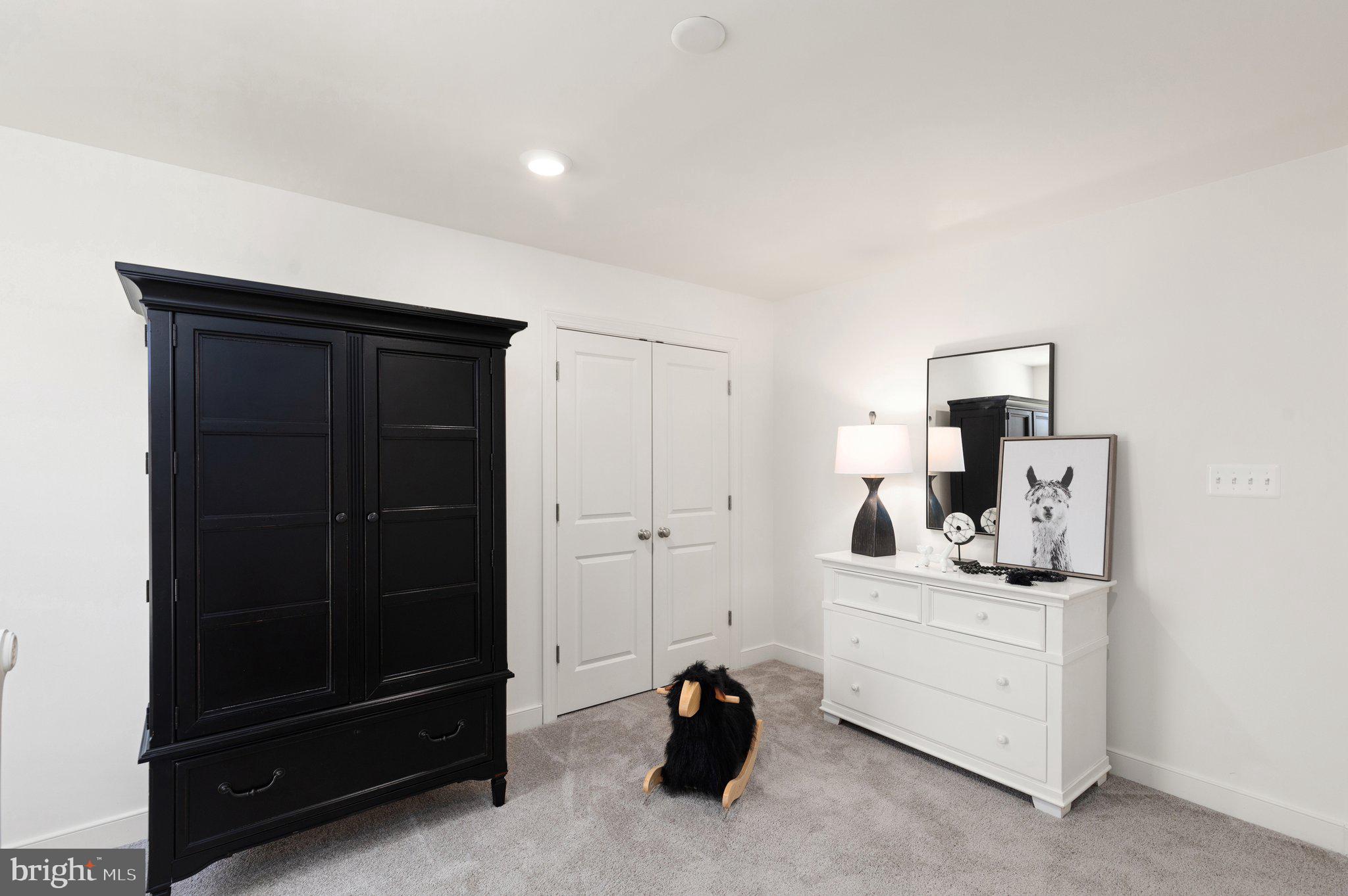 529 C Trimble Road Joppa, MD 21085 - Photo 4 of 26 a room with a dresser and a mirror