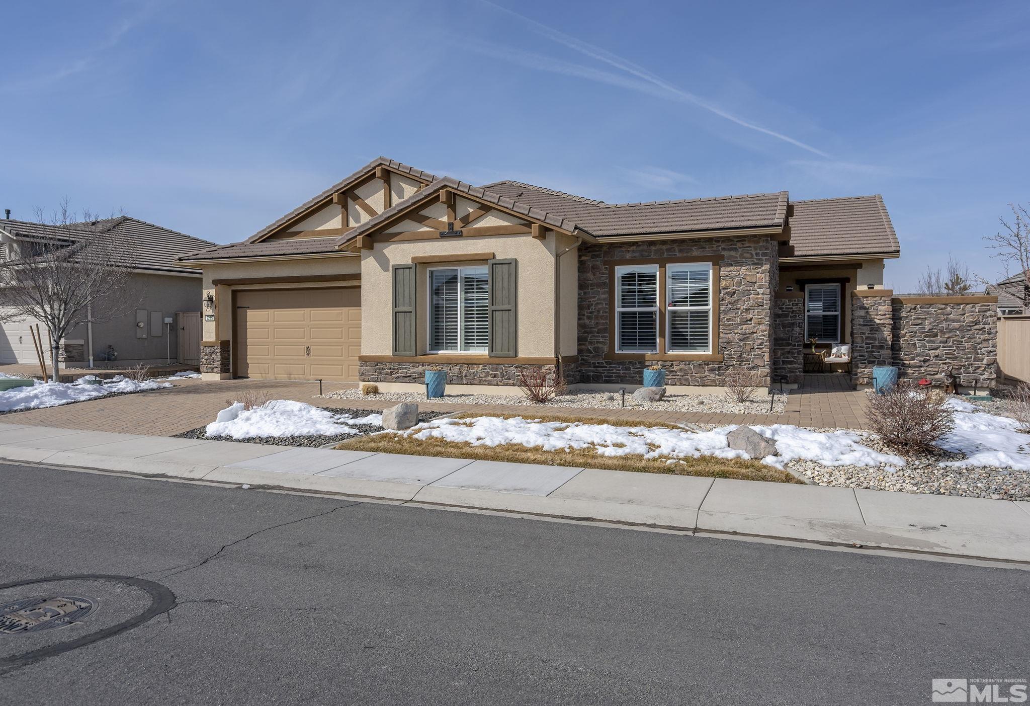 2215 Trakehner Lane Reno, NV 89521 - Photo 1 of 23 a front view of a house with a yard