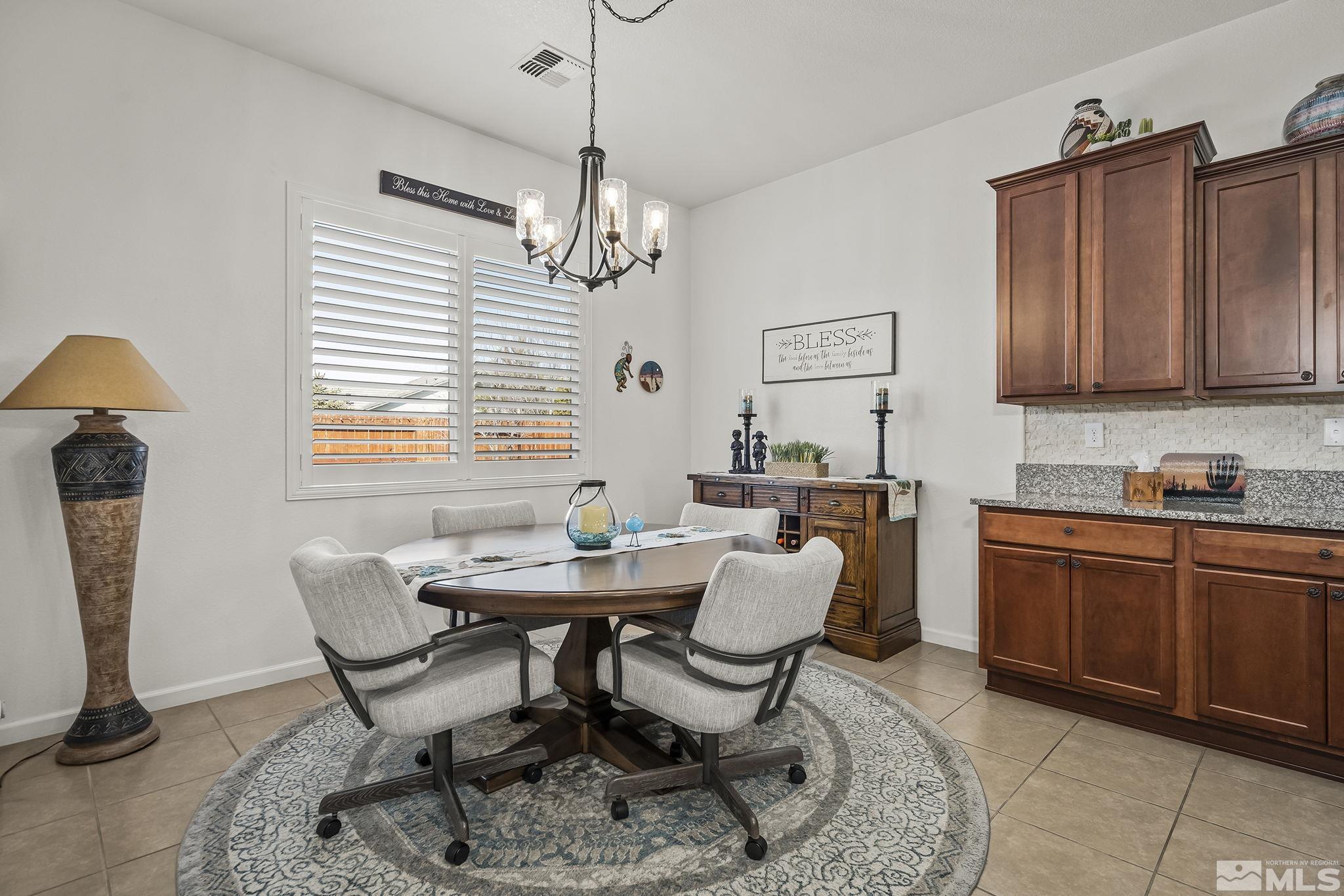 2215 Trakehner Lane Reno, NV 89521 - Photo 11 of 23 a view of a dining room with furniture