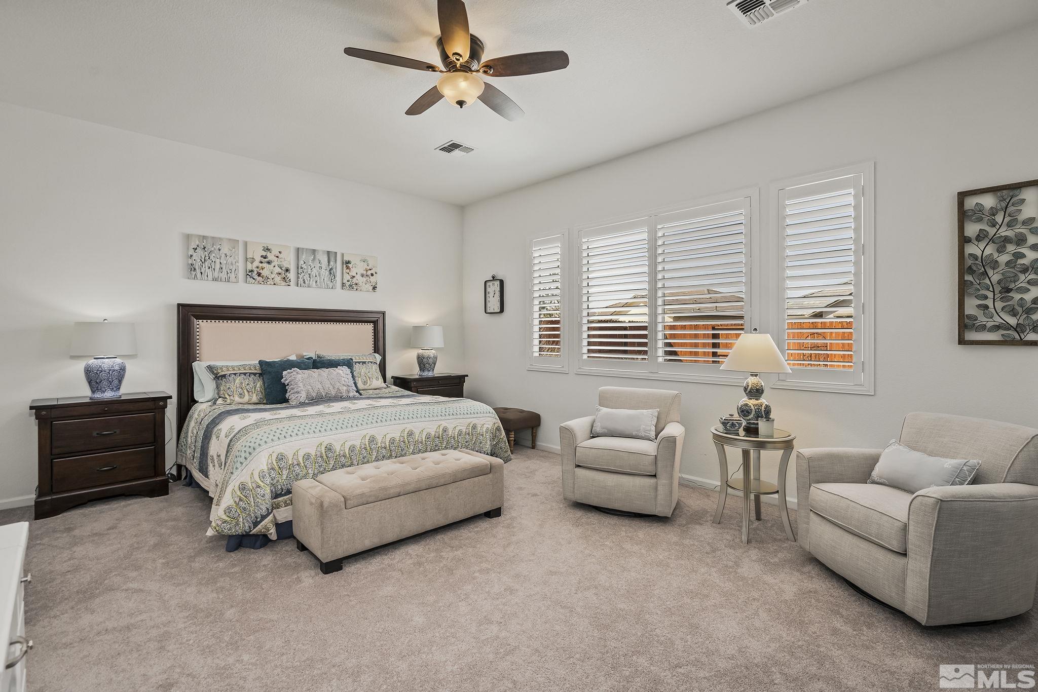 2215 Trakehner Lane Reno, NV 89521 - Photo 12 of 23 a bedroom with furniture and a large window