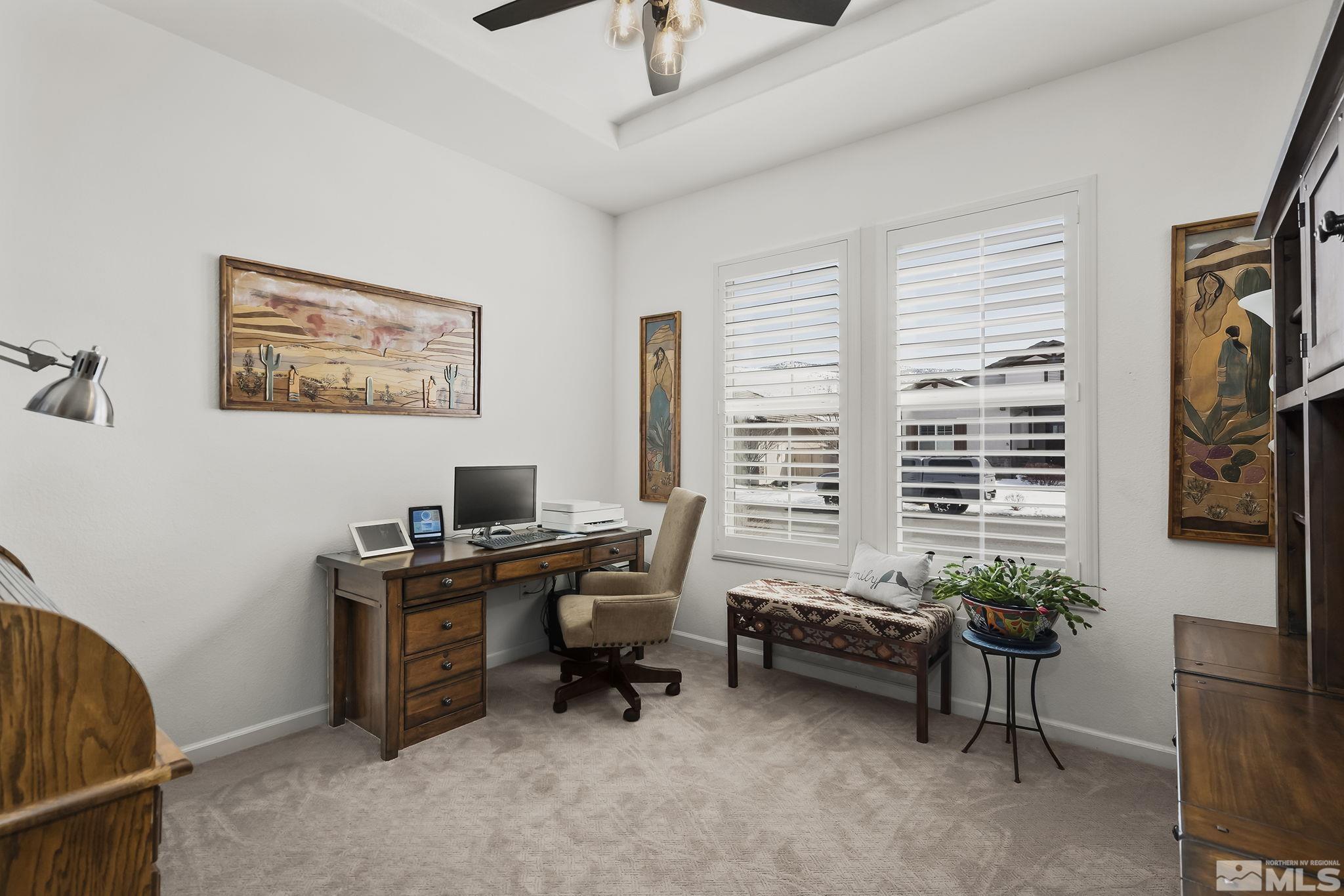2215 Trakehner Lane Reno, NV 89521 - Photo 15 of 23 a view of a workspace with a window and a couch