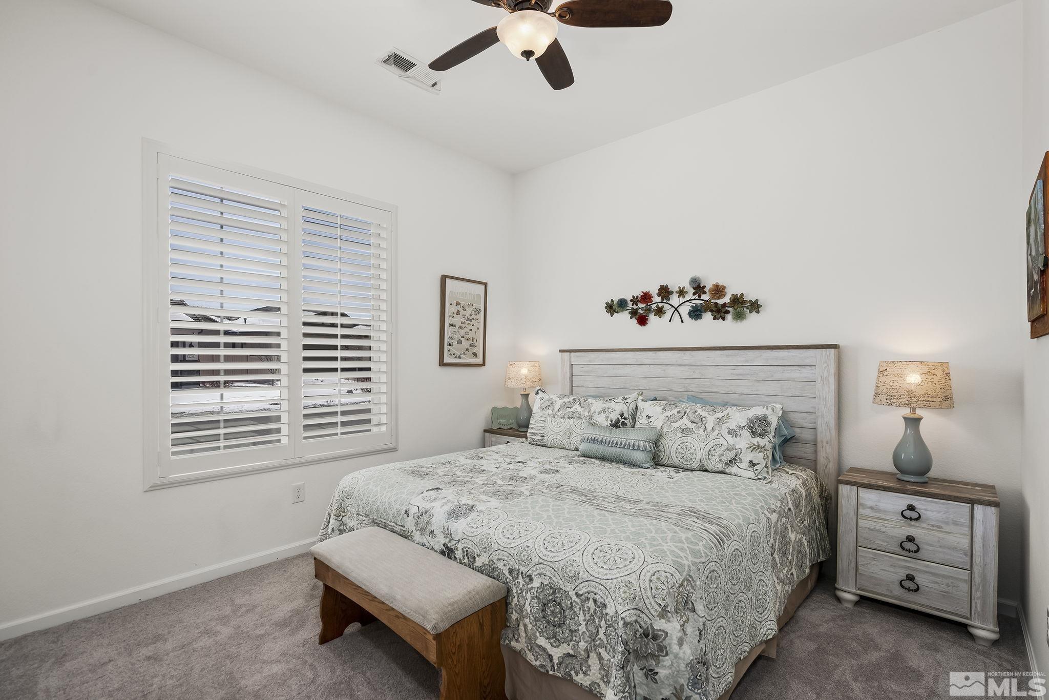 2215 Trakehner Lane Reno, NV 89521 - Photo 16 of 23 a bedroom with a bed and a window