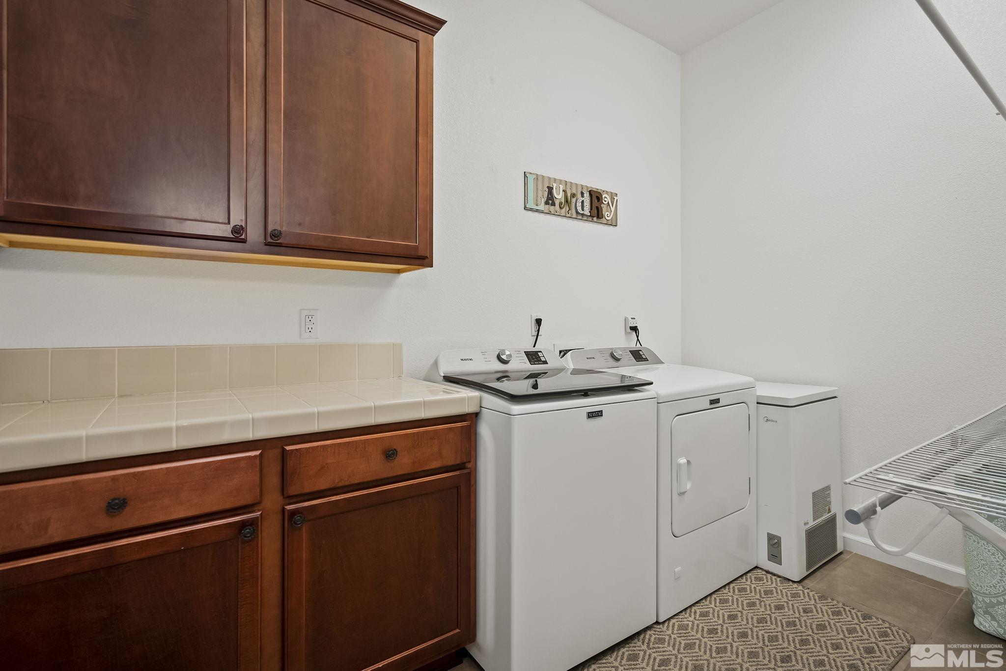2215 Trakehner Lane Reno, NV 89521 - Photo 19 of 23 a utility room with sink dryer and washer