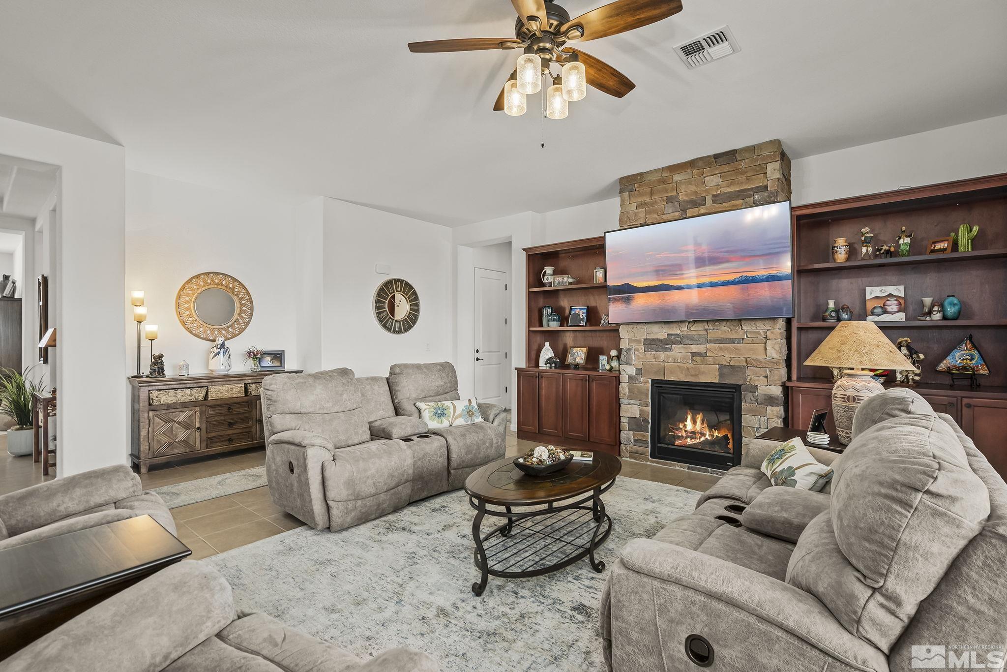2215 Trakehner Lane Reno, NV 89521 - Photo 5 of 23 a living room with furniture and a fireplace