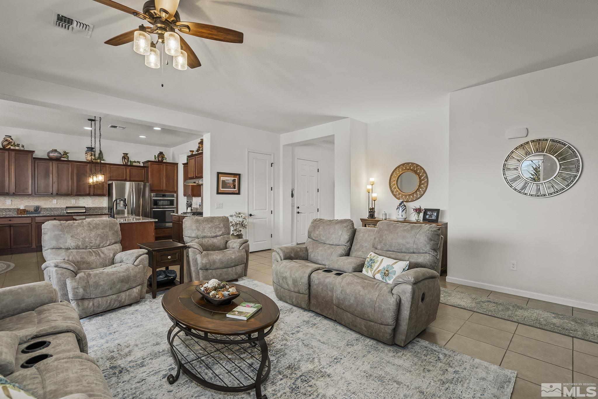 2215 Trakehner Lane Reno, NV 89521 - Photo 6 of 23 a living room with furniture and a rug