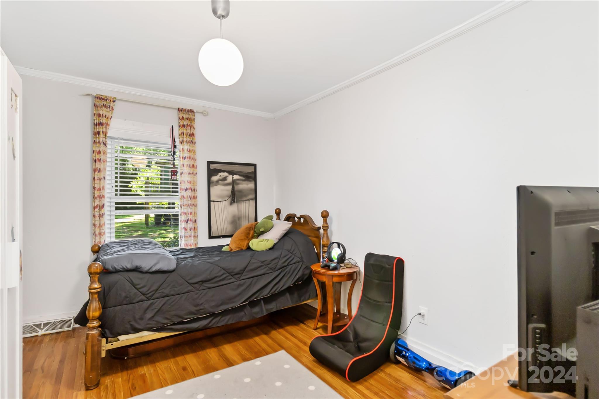5500 Wilora Lake Road Charlotte, NC 28212 - Photo 22 of 32 a bed room with furniture and a window
