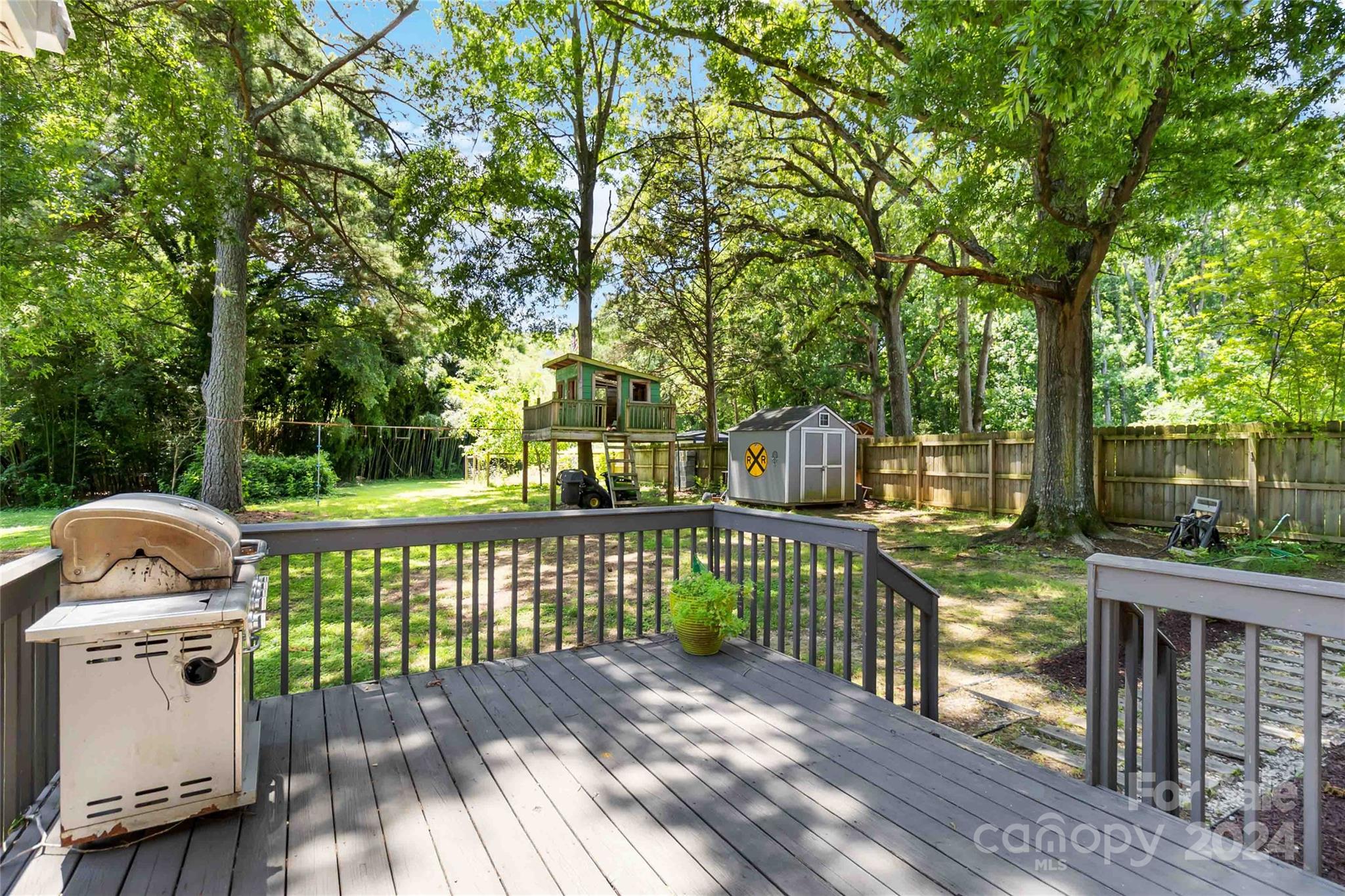 5500 Wilora Lake Road Charlotte, NC 28212 - Photo 23 of 32 a view of a deck with a table and chairs
