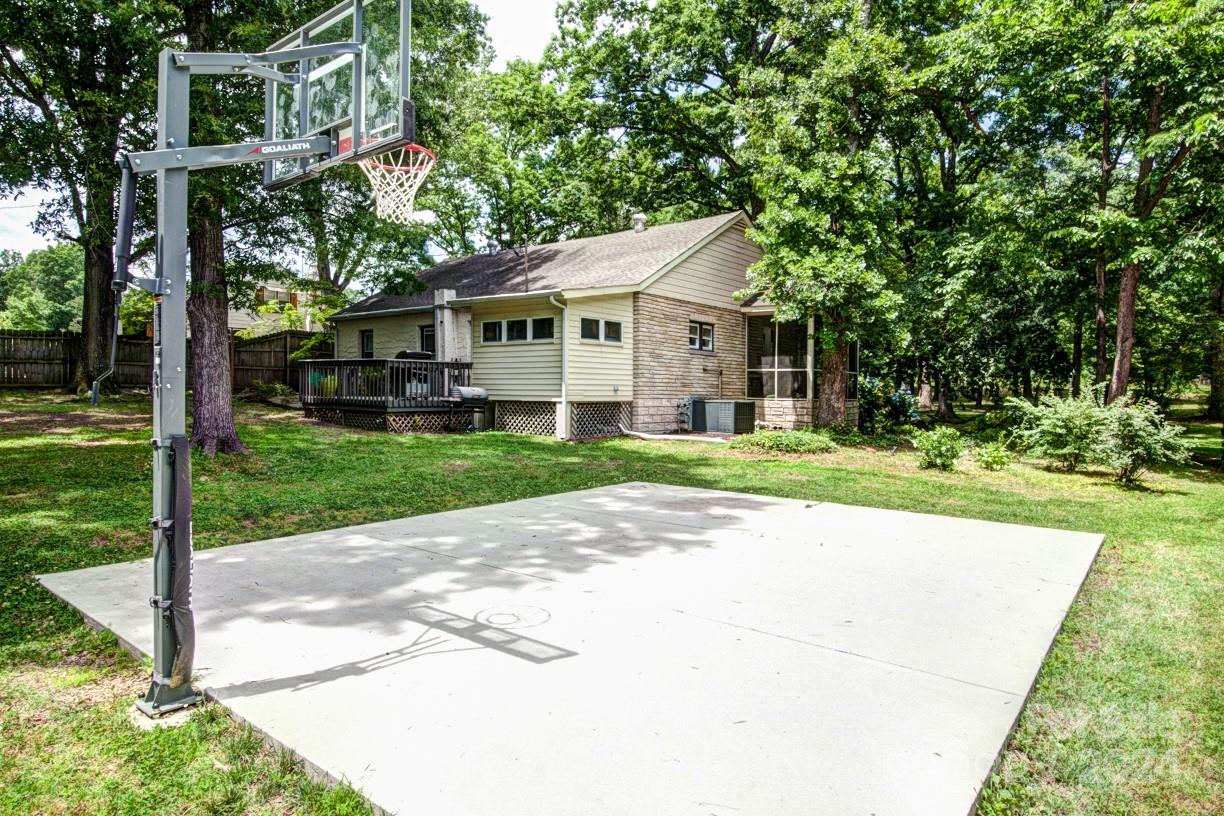 5500 Wilora Lake Road Charlotte, NC 28212 - Photo 27 of 32 a view of a house with a big yard plants and large trees