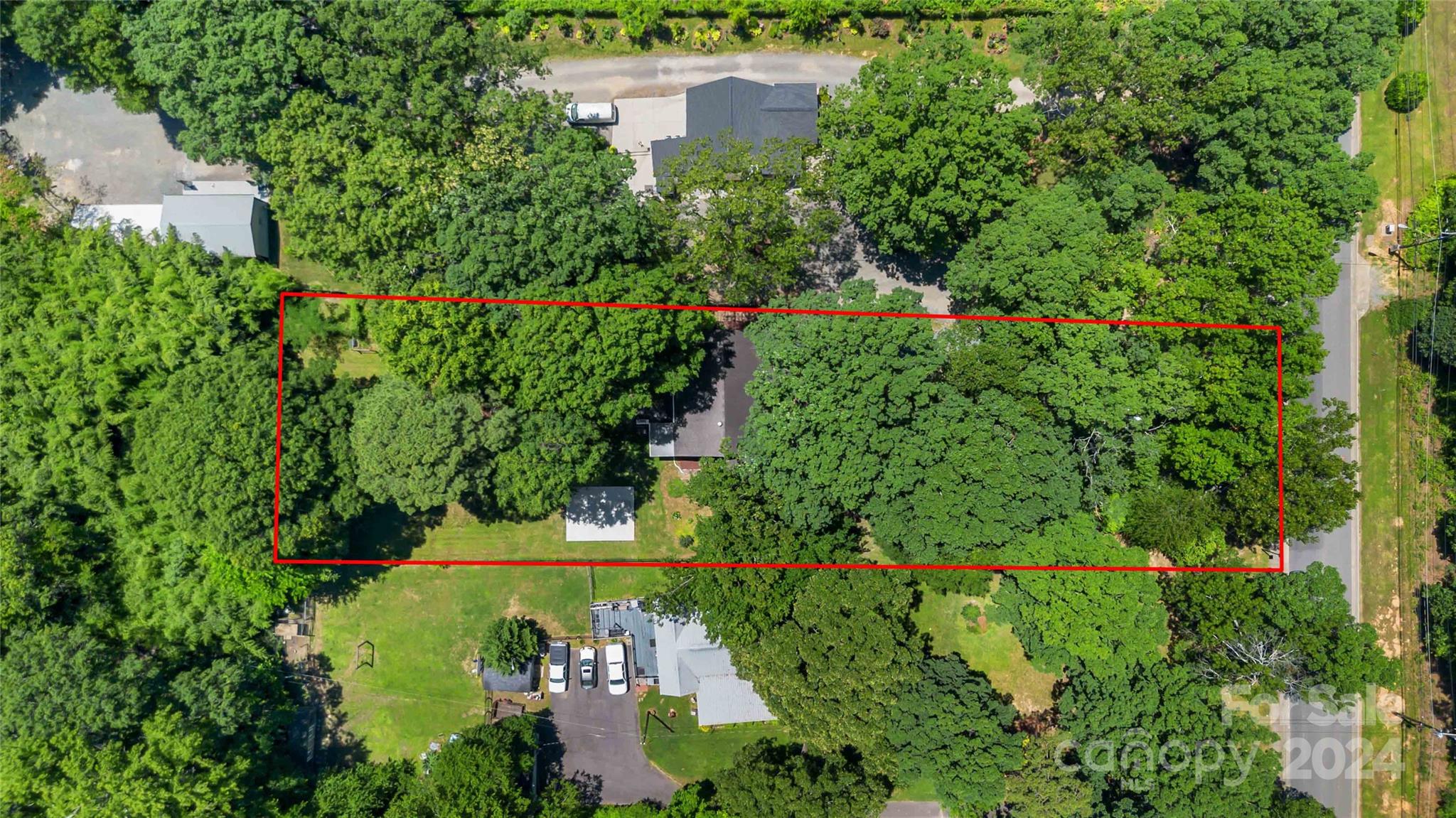 5500 Wilora Lake Road Charlotte, NC 28212 - Photo 31 of 32 an aerial view of a house with a yard and lake view