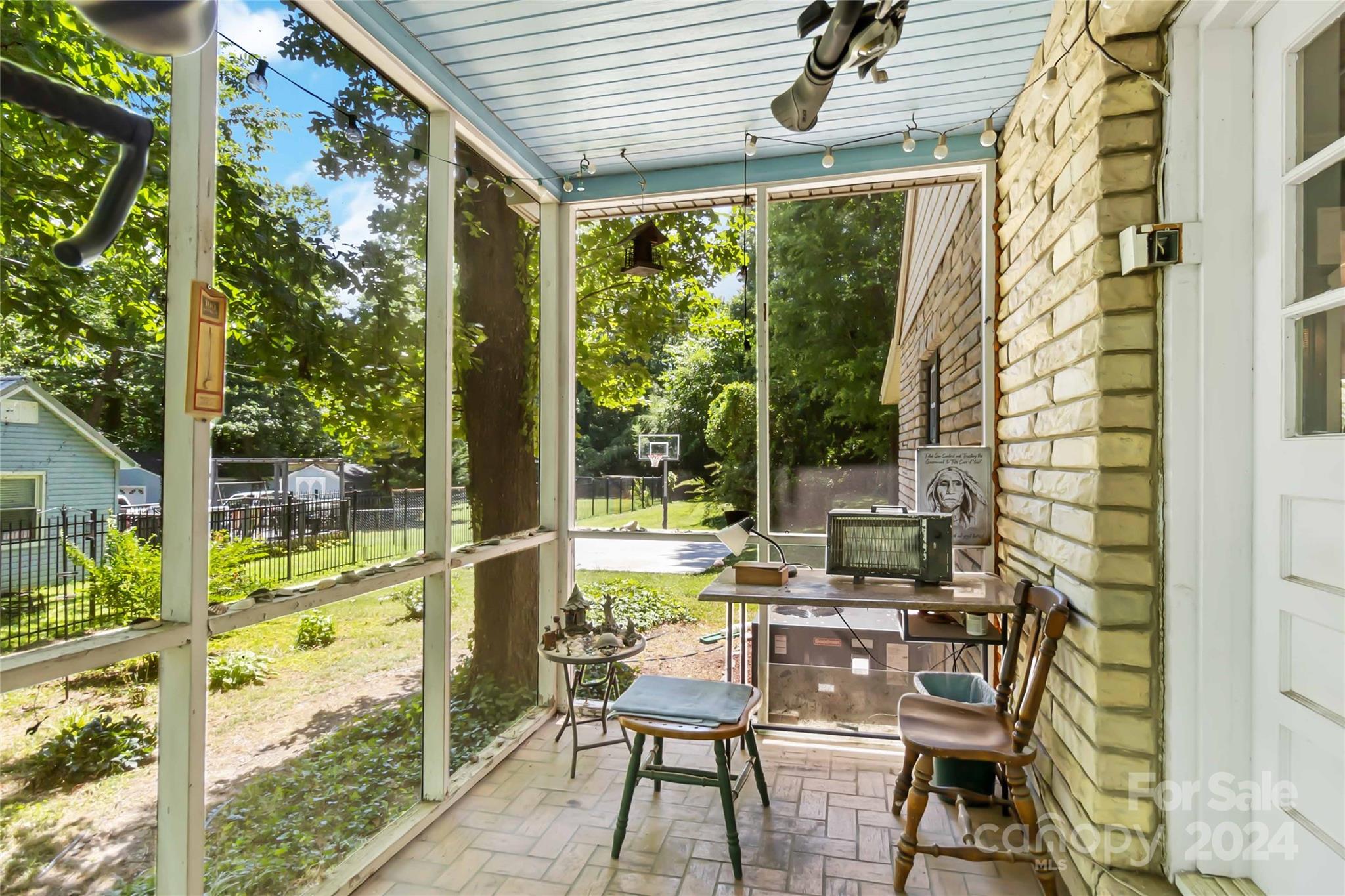 5500 Wilora Lake Road Charlotte, NC 28212 - Photo 8 of 32 a view of a patio with table and chairs and wooden floor