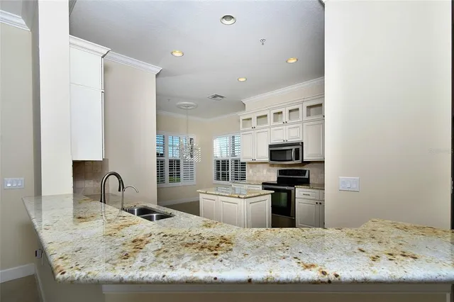 $974,000 | 8051 Players Cove Drive, Unit 202, Naples, FL 34113