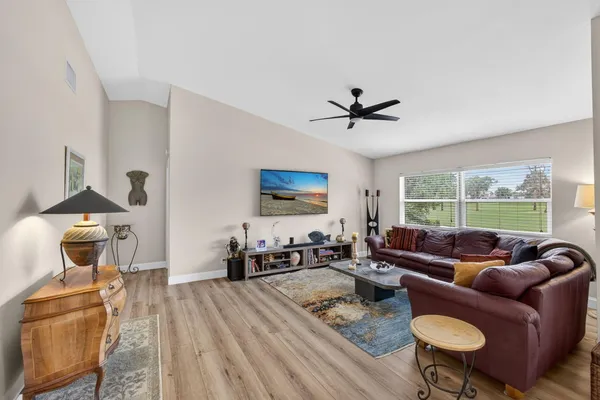 a living room with furniture and a large window