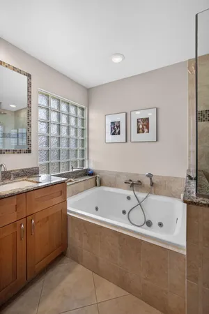 a bathroom with double sink and a mirror