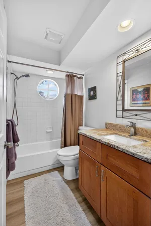 a view of a house with a yard and potted plants