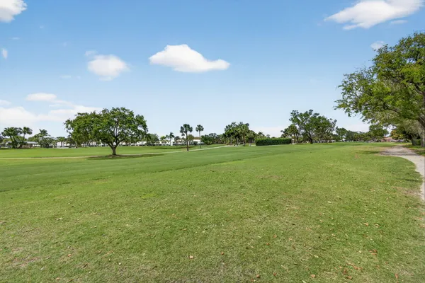 an aerial view of a house with garden space and street view