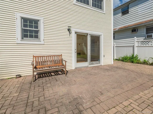 a view of a house with a bench