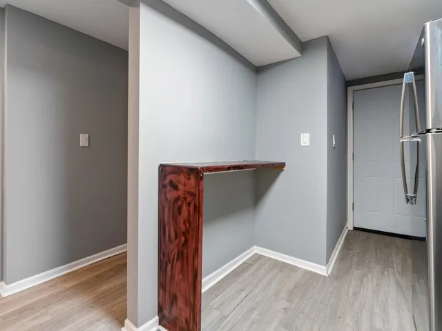 a view of walk in closet with clothes