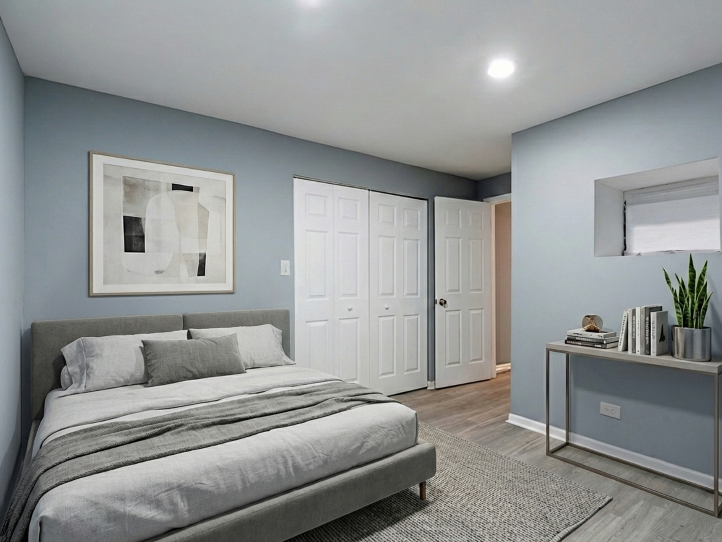 5431 South Indiana Avenue, Unit G Chicago, IL 60615 - Photo 8 of 10 a bedroom with a bed and a couch