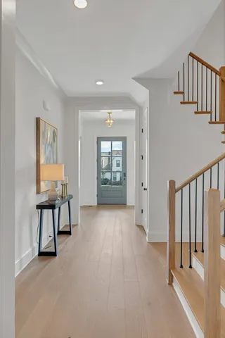 a view of a dining room with furniture wooden floor and chandelier
