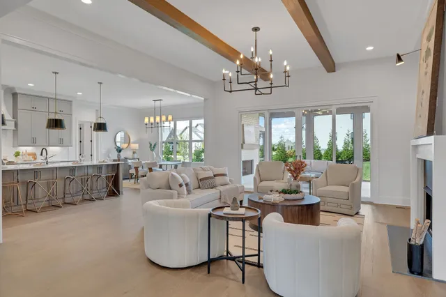 a kitchen with granite countertop white cabinets and stainless steel appliances