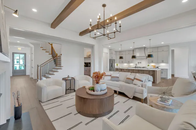 a view of a kitchen with white cabinets and a stove top oven