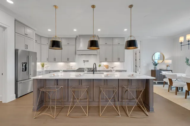 a bathroom with a sink a vanity and a large mirror