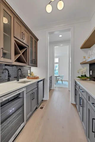 a bathroom with a double vanity sink and a mirror