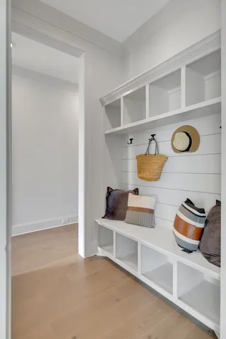 an empty room with windows and entrance