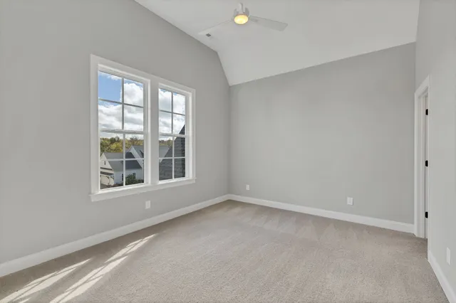 an aerial view of residential houses with outdoor space and city view