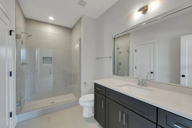 an aerial view of residential houses with outdoor space and river view