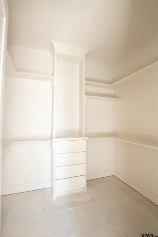 a view of an empty walk in closet