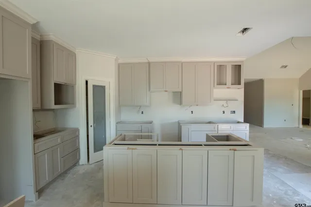 a kitchen with stainless steel appliances a refrigerator and a stove