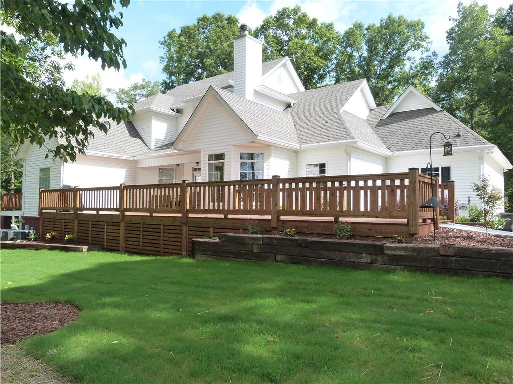 1650 Locklin Cemetery Road Monroe, GA 30655 - Photo 42 of 72 a view of a house with a yard and sitting area