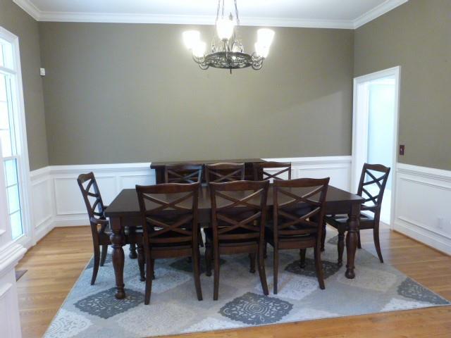 1650 Locklin Cemetery Road Monroe, GA 30655 - Photo 48 of 72 a view of a dining room with furniture and wooden floor