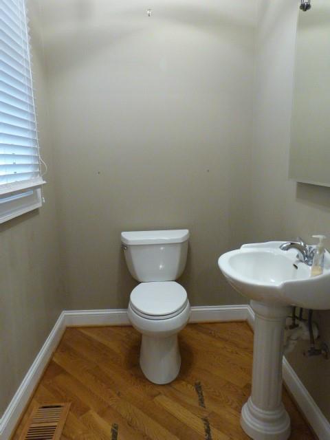 1650 Locklin Cemetery Road Monroe, GA 30655 - Photo 67 of 72 a bathroom with a toilet and a sink
