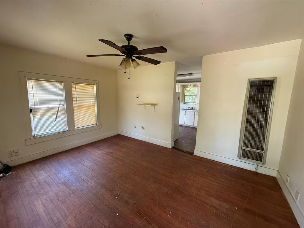 1724 McFerrin Avenue Waco, TX 76708 - Photo 3 of 11 a view of empty room with wooden floor and fan