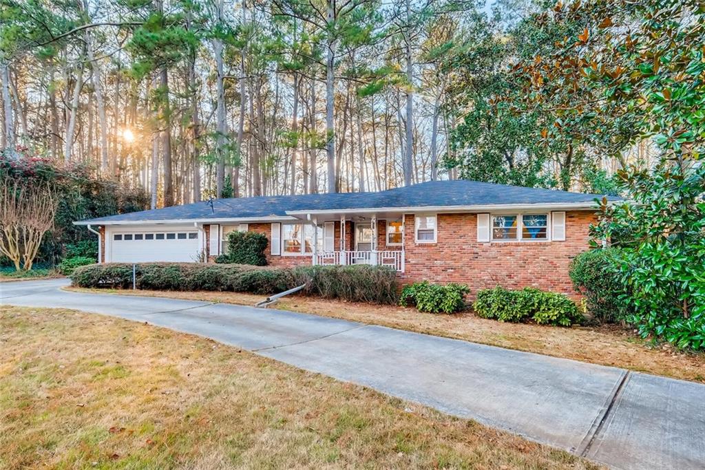 a view of house with yard