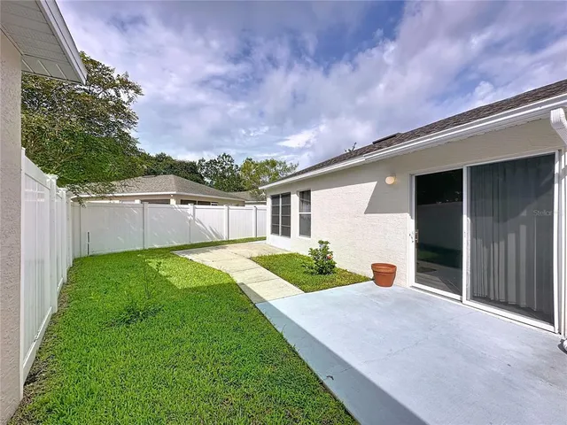 a view of an empty room and wooden floor