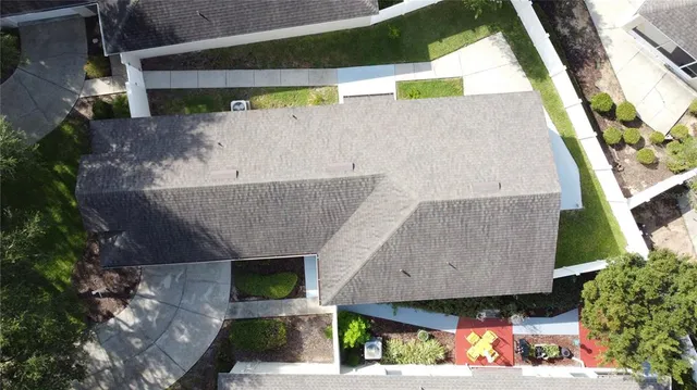 an aerial view of a houses with outdoor space