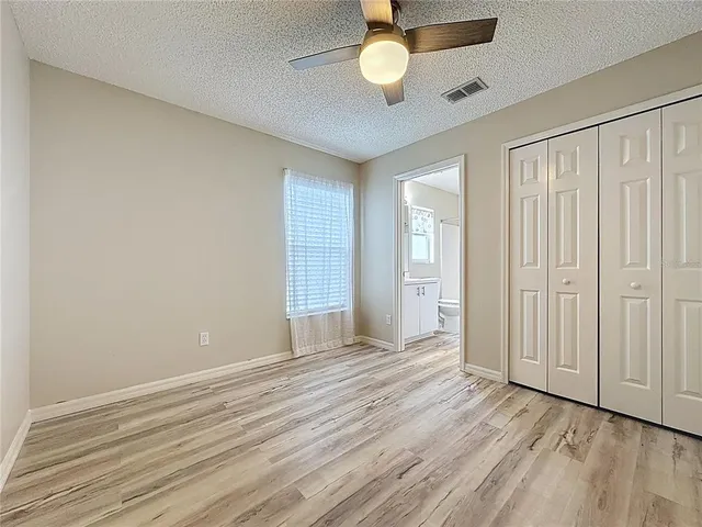 a view of a house with swimming pool and sitting area