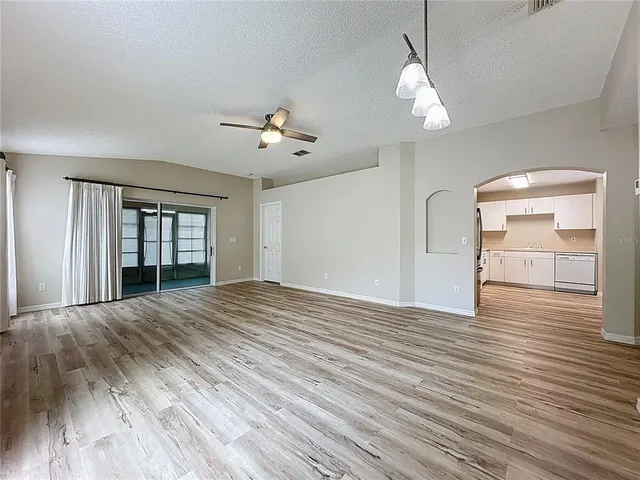 a lobby with furniture and a flat screen tv