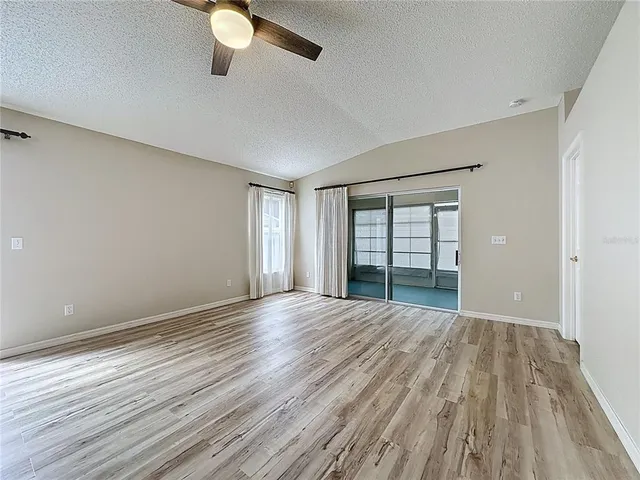 a view of swimming pool with outdoor seating and lake