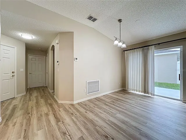 a backyard of a house with lots of green space