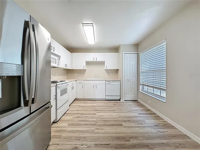 an aerial view of a house with outdoor space
